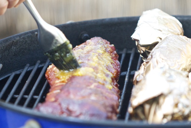 Basted the baby back ribs with orange mango BBQ sauce | Cooking-Outdoors.com | Gary House