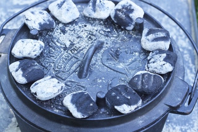 Coals on top of Dutch oven | Cooking-Outdoors.com | Gary House