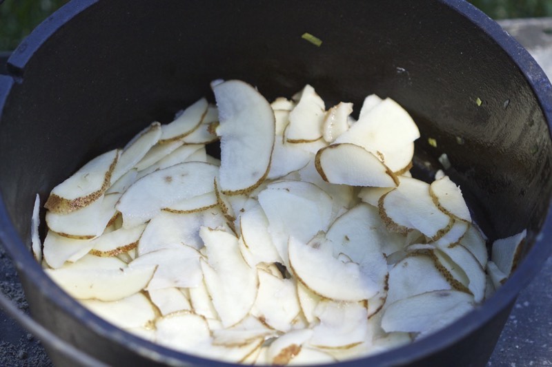 Layer thin sliced Idaho potatoes | Cooking-Outdoors.com | Gary House