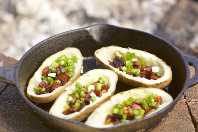 Add linguica, onions, green onions to the potato skins | Cooking-Outdoors.com | Gary House