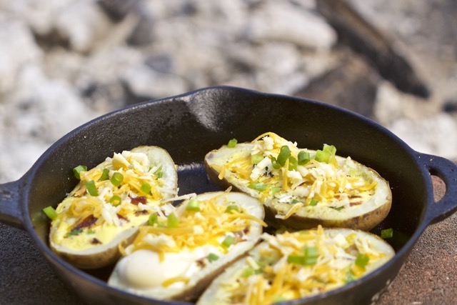Adding cheese to the breakfast potato boats during last few minutes of cooking | Cooking-Outdoors.com | Gary House