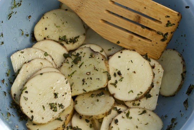 Idaho Potato slices mixed with fresh herbs | Cooking-Outdoors.com | Gary House