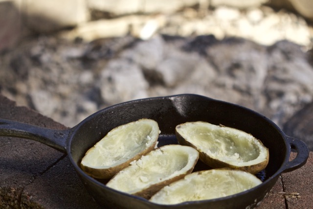 Scooped out potatoes in cast iron skillet | Cooking-Outdoors.com | Gary House